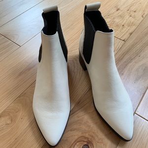 White and black boots by dolce vita.